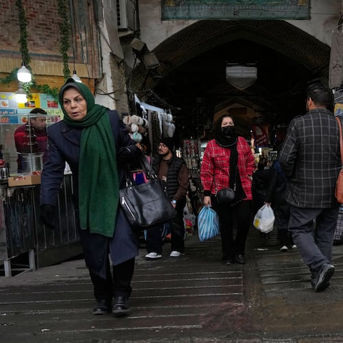 People walk at Tehran's historic Grand Bazaar, Tuesday, Jan. 20, 2026, in Iran. (AP Photo/Vahid Salemi)