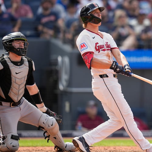 Cleveland Guardians' Petey Halpin, right, and catcher Kyle Teel, left, watch Halpin''s three-run home run in the sixth inning of a baseball game in Cleveland, Wednesday, Sept. 16, 2026. (AP Photo/Sue Ogrocki)
