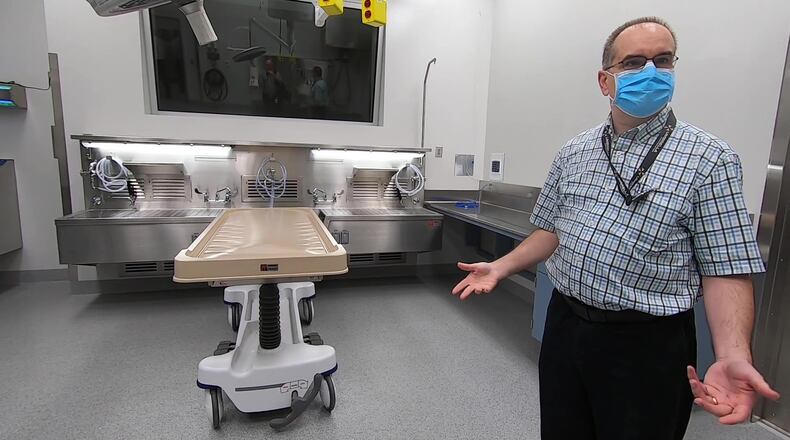 Cobb Medical Examiner Dr. Christopher Gulledge gives a tour of the new $11 million building for the department.