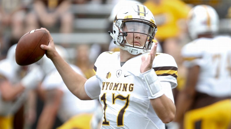 Quarterback Josh Allen of the Wyoming Cowboys warms up before the matchup against the Iowa Hawkeyes, on September 2, 2017 at Kinnick Stadium in Iowa City, Iowa. (Photo by Matthew Holst/Getty Images)