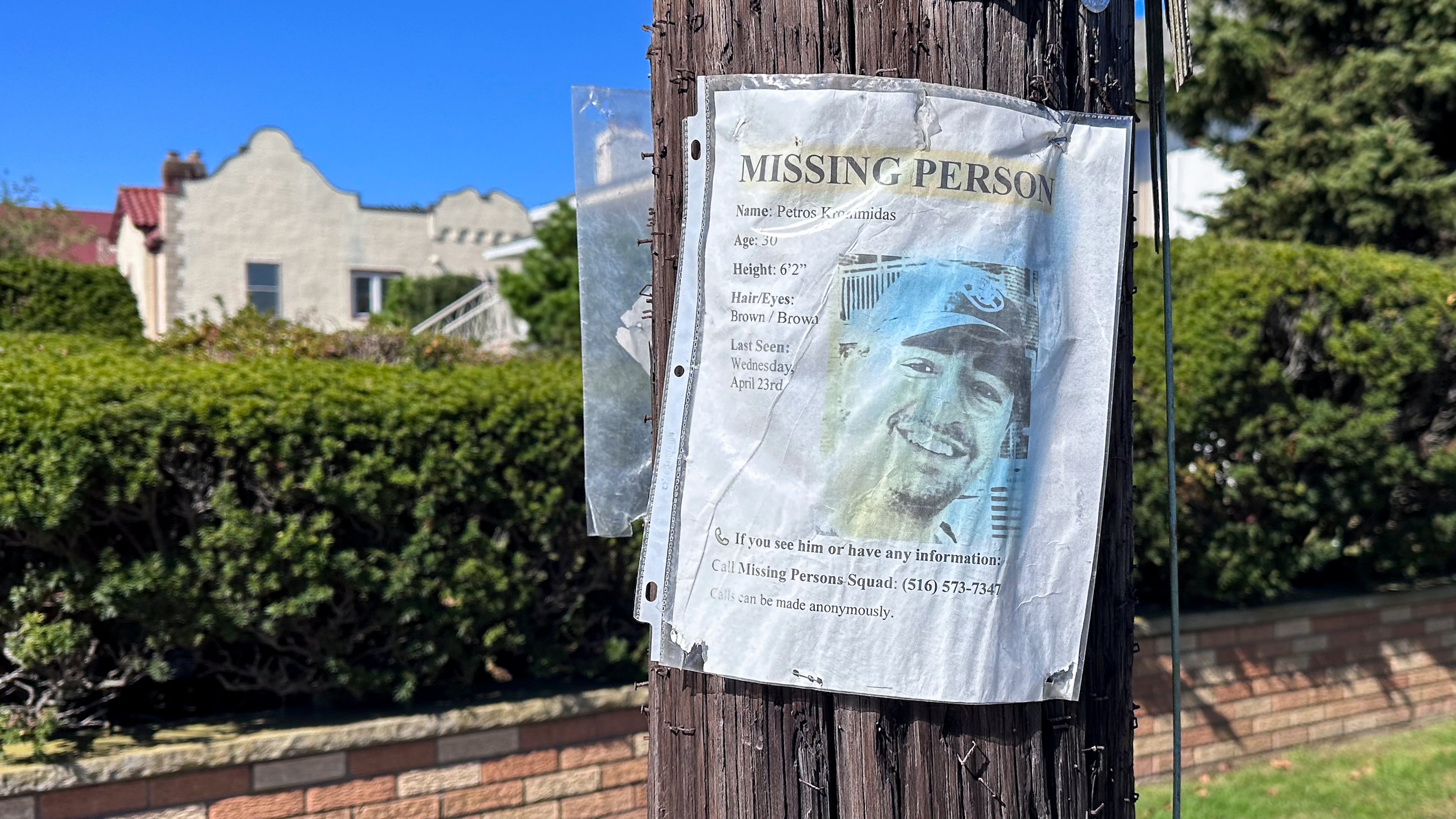 A missing person flyer for Petros Krommidas hangs on a telephone pole, Thursday, October. 9, 2025, in Long Beach, N.Y. (AP Photo/Phillip Marcelo)