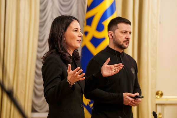 German Foreign Minister Annalena Baerbock and Ukrainian President Volodymyr Zelenskyy speak to journalists during a press conference in Kyiv, Ukraine, Tuesday, April 1, 2025. (AP Photo/Evgeniy Maloletka)