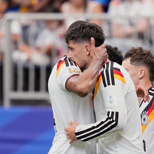Germany's Kai Havertz celebrates with teammate Jonathan Tah, left, after scoring his side's third goal during the World Cup Group E soccer match between Germany and Curacao in Houston, Sunday, June 14, 2026. (AP Photo/Karen Warren)