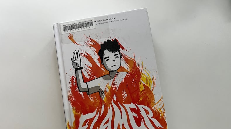 "Flamer" by Mike Curato, a graphic novel set in a 1995 summer camp about a boy who is bullied for appearing gay, has been removed from schools in Cobb County and Marietta for containing "sexually explicit content." This copy was checked out from the Fulton County Library System.