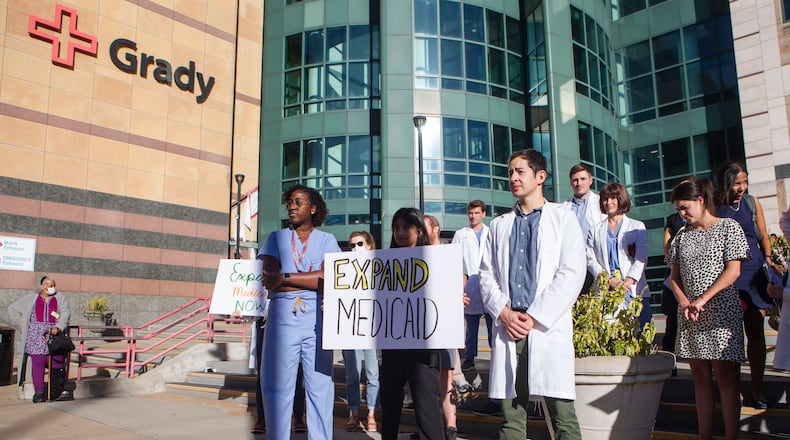 Until recently, health care loomed large over every corner of the political landscape in Georgia for votes. Pictured are health care professionals stand in front of Grady Hospital during a news conference on Sept. 27, 2022. (Christiana Matacotta for the Atlanta Journal-Constitution)