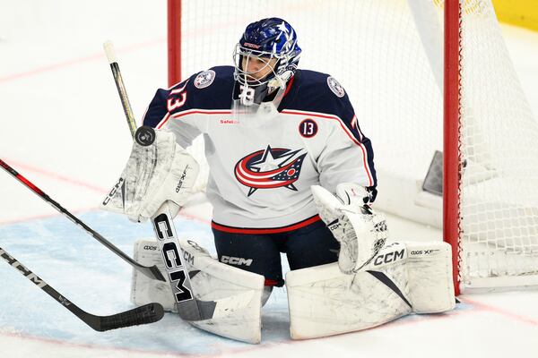 Columbus Blue Jackets goaltender Jet Greaves (73) tracks the puck during the third period of an NHL hockey game against the Washington Capitals, Sunday, April 13, 2025, in Washington. (AP Photo/Nick Wass)