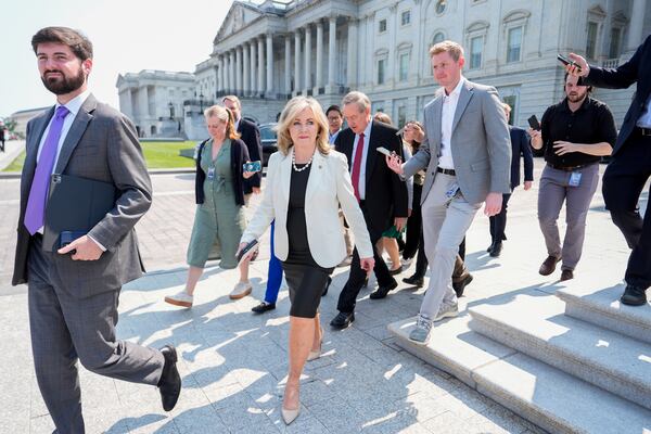 Sen. Marsha Blackburn, R-Tenn., walks to board a bus to the White House with other Senate Republicans for a meeting with President Donald Trump on his spending and tax bill, Wednesday, June 4, 2025, outside the U.S. Capitol in Washington. (AP Photo/Julia Demaree Nikhinson)