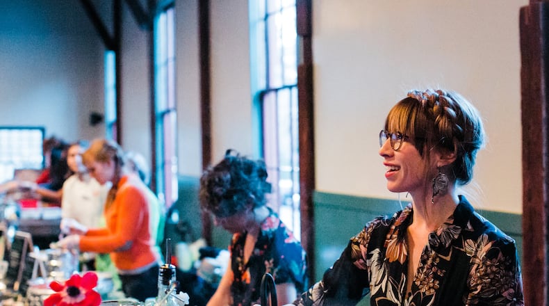 A chef prepares bites at the Lady Locavores event. Contributed by Jenna Shea Photography