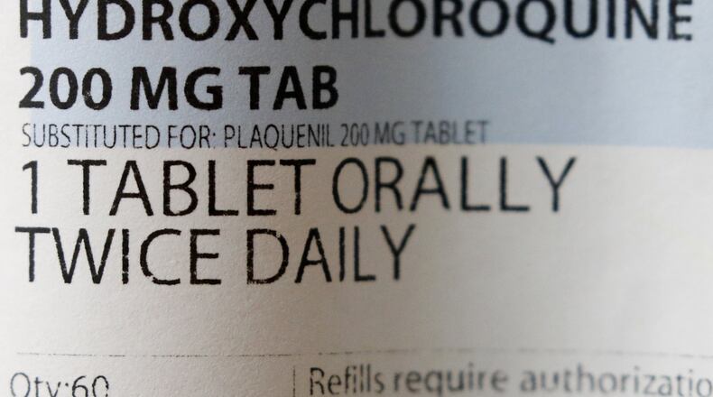 A label affixed to a bottle containing a prescription of hydroxychloroquine. President Donald Trump and his administration are promoting the anti-malaria drug not yet officially approved for fighting the new coronavirus, but scientists say more testing is needed before it’s proven safe and effective against COVID-19. (AP Photo/John Locher)