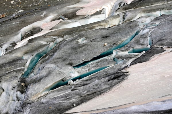 A lake of meltwater has formed on the tongue of the Rhone Glacier near Goms, Switzerland, June 10, 2025. (AP Photo/Matthias Schrader)