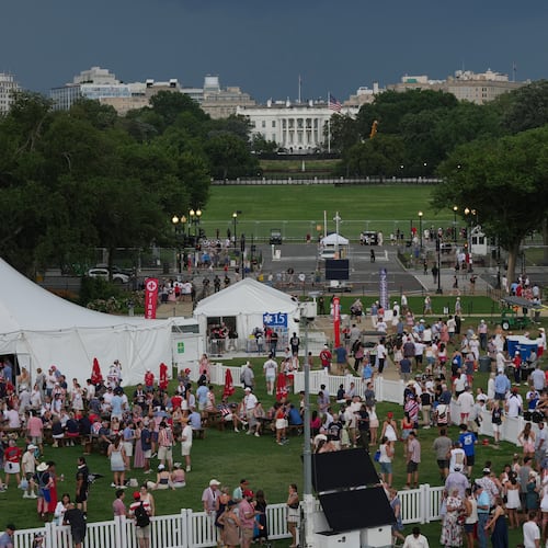 The White House is seen in the distance as people evacuate the area after people were told of incoming storms that will delay the program at a Salute to America Independence Day event honoring the nation's 250th anniversary, Saturday, July 4, 2026, on the National Mall in Washington. (AP Photo/Julia Demaree Nikhinson)