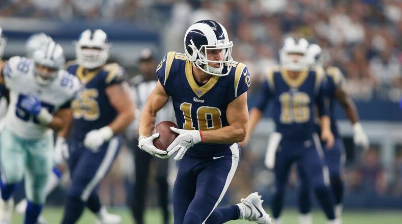 Los Angeles Rams wide receiver Cooper Kupp runs after catching a pass in the fourth quarter against the Dallas Cowboys at AT&T Stadium.