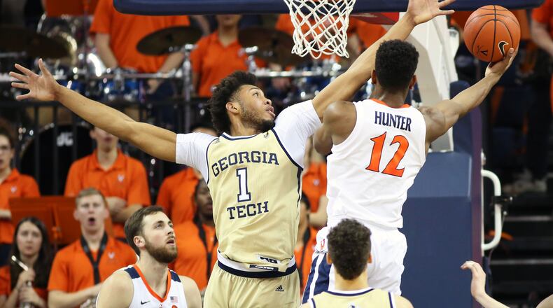 CHARLOTTESVILLE, VA - FEBRUARY 27: De'Andre Hunter #12 of the Virginia Cavaliers shoots past James Banks III #1 of the Georgia Tech Yellow Jackets in the first half during a game at John Paul Jones Arena on February 27, 2019 in Charlottesville, Virginia. (Photo by Ryan M. Kelly/Getty Images)