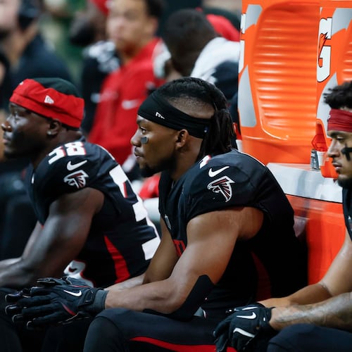 Atlanta Falcons running back Bijan Robinson (center) fumbled the ball in the third quarter Sunday. It was recovered by Miami. (Miguel Martinez/AJC)