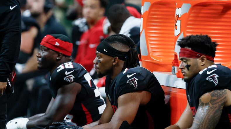 Atlanta Falcons running back Bijan Robinson (center) fumbled the ball in the third quarter Sunday. It was recovered by Miami. (Miguel Martinez/AJC)