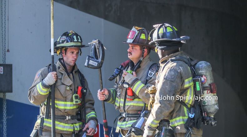 Atlanta fire crews were called to the high-rise on West Peachtree Street after reports of an explosion. Investigators later determined that part of a sprinkler system malfunctioned.