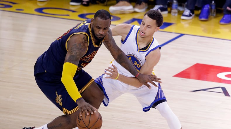 Play it again already: Golden State's Steph Curry pesters Cleveland's LeBron James during one of their many NBA Finals moments. (AP Photo/Eric Risberg, File)