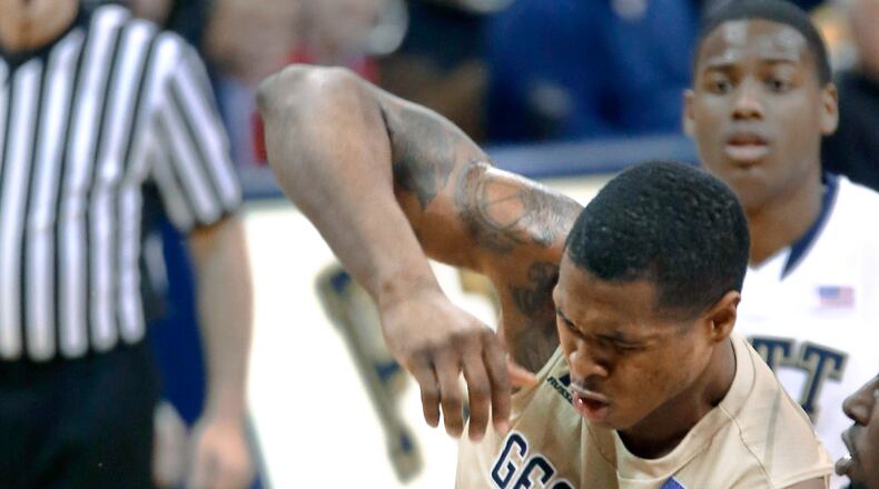 Georgia Tech's Marcus Georges-Hunt (3) collides with Pittsburgh's James Robinson, left after a shot in the second half of an NCAA college basketball game, Saturday, Jan. 17, 2015, in Pittsburgh. (AP Photo/Keith Srakocic) Georgia Tech forward Marcus Georges-Hunt had a career-best game from the free-throw line but struggled shooting from the field. (ASSOCIATED PRESS)