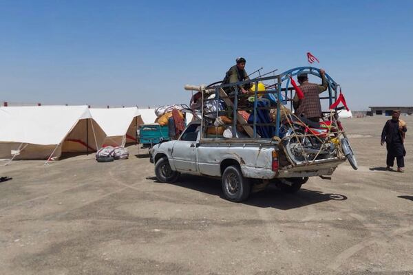An Afghan refugee's family arrives at a transit station setup to facilitate Afghan refugees' deportations, outskirt of Chaman, a border town on the Pakistan and Afghanistan border, Thursday, April 3, 2025. (AP Photo/Jafar Khan)