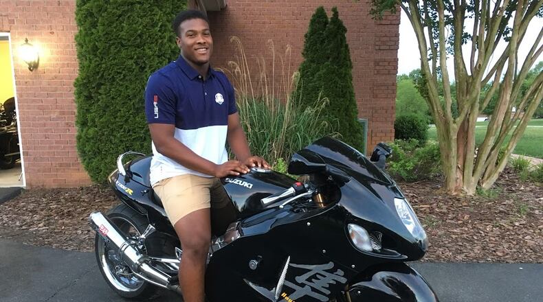 Georgia Tech freshman linebacker Justice Dingle astride his father's Suzuki Hayabusa motorcycle at the family's home in Bowling Green, Ky. Dingle said he wasn't planning on bringing it to campus. While the Hayabusa can reach speeds of nearly 200 miles per hour, Dingle said he doesn't go nearly that fast on it.
