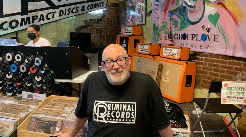 Eric Levin, owner of Criminal Records, in front of the stage at his store on July 31, 2021. RODNEY HO/rho@ajc.com