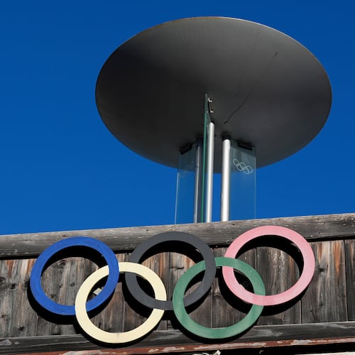 FILE - The Olympic rings adorn the Stadio Olimpico del Ghiaccio, which will be called Cortina Curling Olympic Stadium, venue for the curling discipline at the Milan Cortina 2026 Winter Olympics, in Cortina d'Ampezzo, Italy, Thursday, Jan. 16, 2025. (AP Photo/Giovanni Auletta, File)