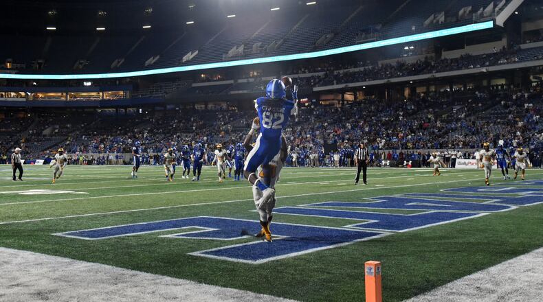 Georgia State wide receiver Diondre Champaigne (82) goes up for his game-winning catch against Kennesaw State Thursday night. (HYOSUB SHIN / HSHIN@AJC.COM)
