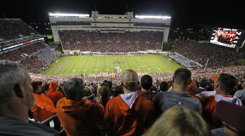 Fans watch the action during the second half of an NCAA college football game in Blacksburg, Va., Saturday, Sept. 30, 2017. Clemson won the game 31-17. (AP Photo/Steve Helber)