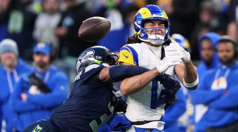 Seattle Seahawks safety Nick Emmanwori, left, breaks up a pass intended for Los Angeles Rams wide receiver Puka Nacua (12) during the first half of the NFC Championship NFL football game Sunday, Jan. 25, 2026, in Seattle. (AP Photo/Lindsey Wasson)