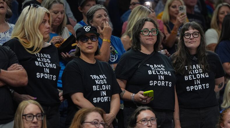 Fans wear shirts saying "Trans Kids Belong In Sports" during a WNBA basketball game between the Minnesota Lynx and the Indiana Fever Sunday, Aug. 2, 2026, in Minneapolis. (AP Photo/Abbie Parr)