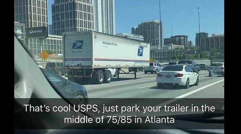A USPS truck broke down on the highway in Atlanta on April 18, 2018.