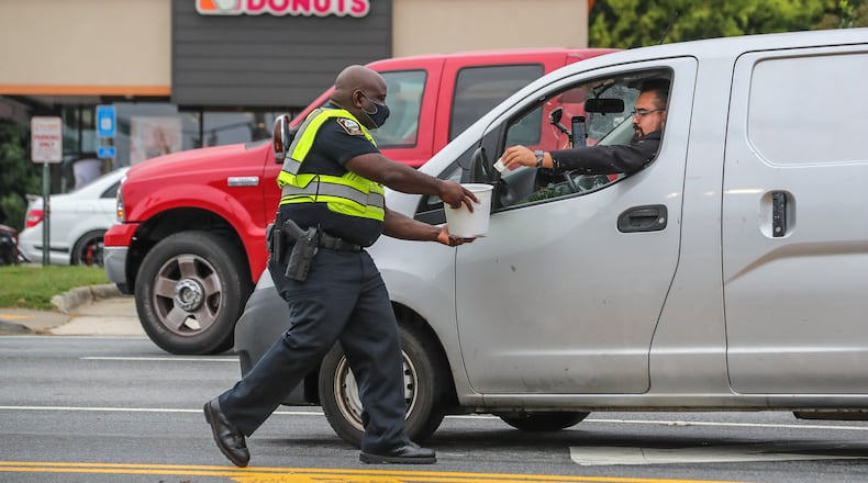 A Suwanee Dunkin' paid back wages for denying an employee sick leave. (John Spink / John.Spink@ajc.com) AJC FILE PHOTO