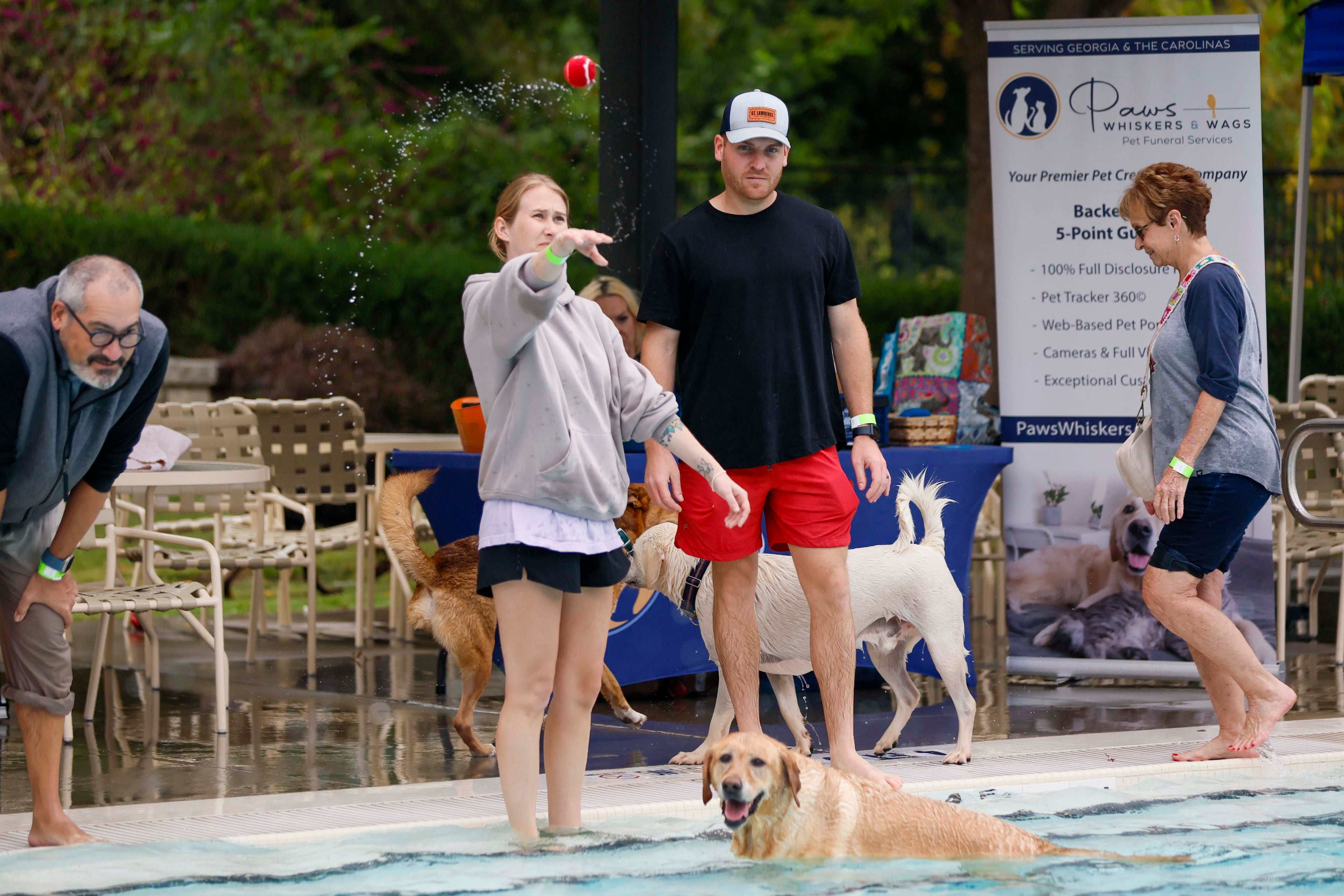 Jenny Chase tosses a ball to Molly (9) as Mike Chase watches during the XV annual Splish Splash Doggie Bash at Piedmont Park on Sunday, October 5, 2025. The proceeds support Piedmont Park Dog Parks.
(Miguel Martinez/ AJC)
