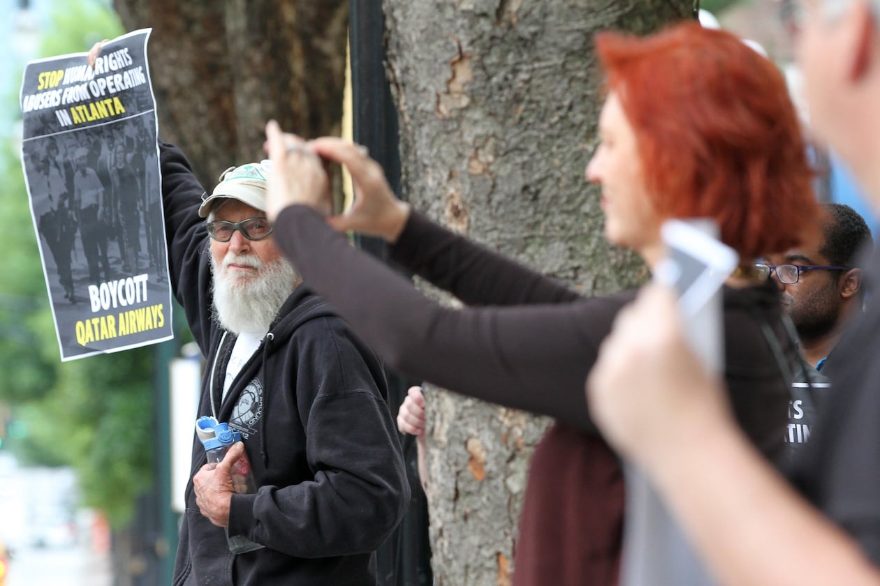 In 2016, Tom Coffin joined a small group protesting that Qatar Airways was adding a new route to Atlanta. (Ben Gray/AJC)