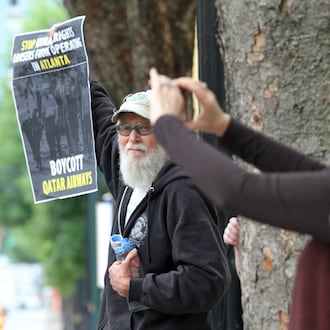 In 2016, Tom Coffin joined a small group protesting that Qatar Airways was adding a new route to Atlanta. (Ben Gray/AJC)
