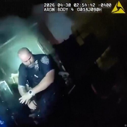 This image made from New York Police Department body camera video shows an officer after an explosion at a house while responding to a call of an armed man Thursday, April 30, 2026, in the Queens borough of New York. (New York Police Department via AP)