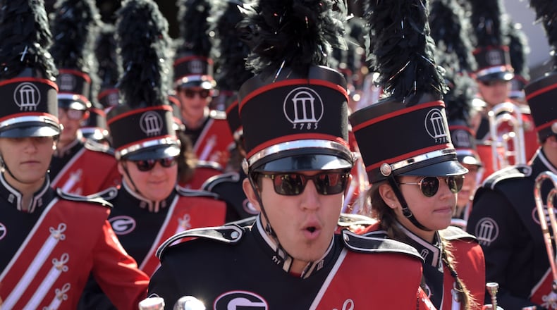 Members of the Georgia Redcoat Marching Band take to the field before the start of a Georgia game. (DAVID BARNES / DAVID.BARNES@AJC.COM)