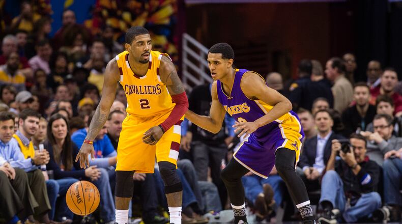 Kyrie Irving (left) of the Cleveland Cavaliers scored just two points in a game Sunday after a bout with bed bugs. But he scored 30 points Monday after recovering from the incident and getting some rest. (Photo by Jason Miller/Getty Images)