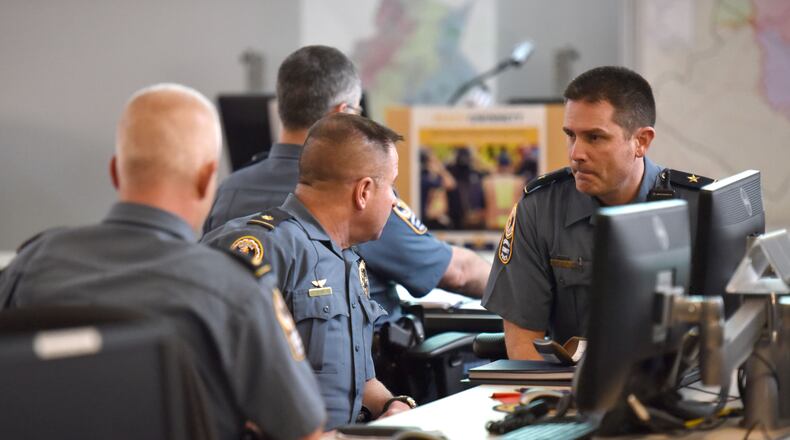 Gwinnett County public safety personnel and other government agencies discuss during their meeting to prepare for the winter weather event that is forecasted for this weekend at Gwinnett County Office of Emergency Management in Lawrenceville on Thursday, January 5, 2017.