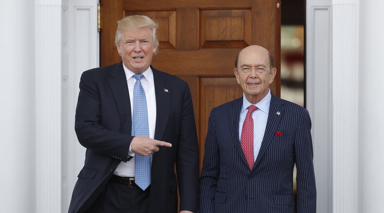 President-elect Donald Trump, left, stands with investor Wilbur Ross after meeting at the Trump National Golf Club Bedminster clubhouse in Bedminster, N.J. recently. (AP Photo/Carolyn Kaster)