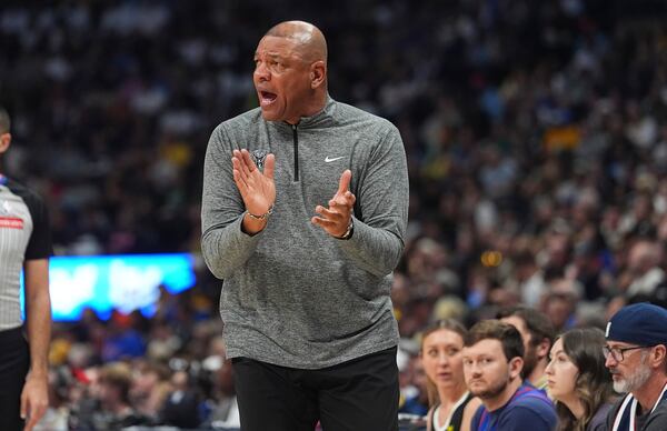 Milwaukee Bucks head coach Doc Rivers directs his team against the Denver Nuggets in the first half of an NBA basketball game Wednesday, March 26, 2025, in Denver. (AP Photo/David Zalubowski)