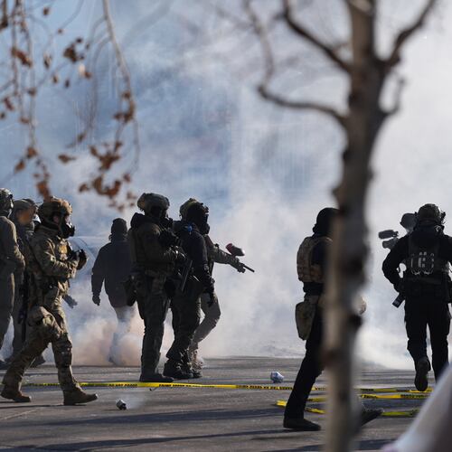 FILE - Federal immigration officers deploy tear gas at protesters after a shooting Jan. 24, 2026, in Minneapolis. (AP Photo/Abbie Parr, File)