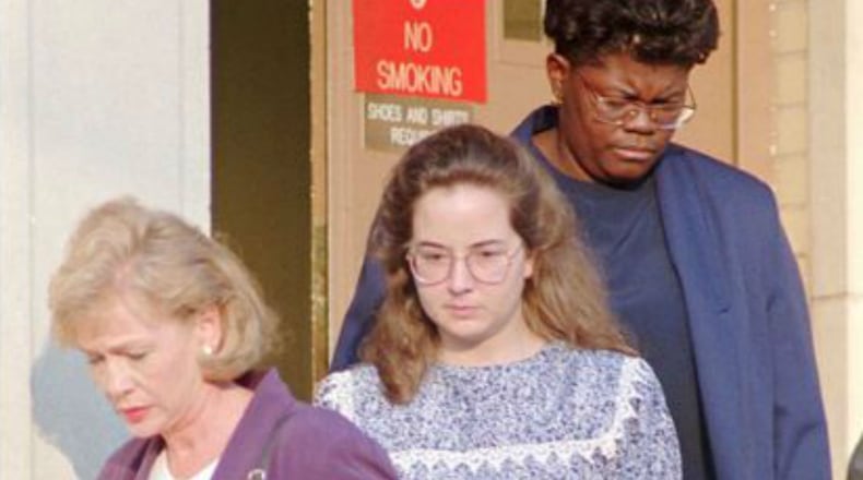 Susan Smith center is escorted from the Union County Courthouse in Union S C on Tuesday July 11 1995 A judge ruled Tuesday that she was competent to stand trial for the murder of her two sons Alex and Micahel Jury selection also began for the trial which is expected to run up to six weeks in length (AP Photo Dave Martin)
