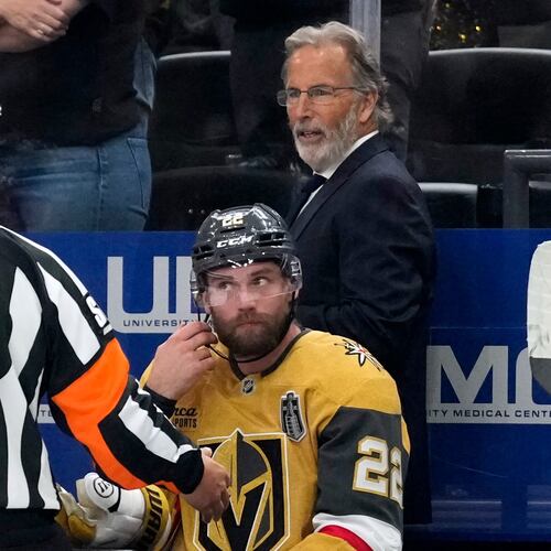 Vegas Golden Knights head coach John Tortorella, right, talks to a referee during the third period in Game 4 of the NHL hockey Stanley Cup Final series against the Carolina Hurricanes, Tuesday, June 9, 2026, in Las Vegas. (AP Photo/John Locher)