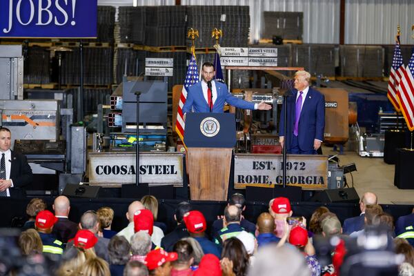 Clay Fuller, who is running for Marjorie Taylor Greene’s former congressional seat, gives a speech during President Donald Trump’s rally at Coosa Steel in February. (Arvin Temkar/AJC)