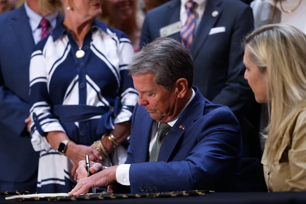 Gov. Brian Kemp signed a series of education bills on Tuesday. (Arvin Temkar/AJC)