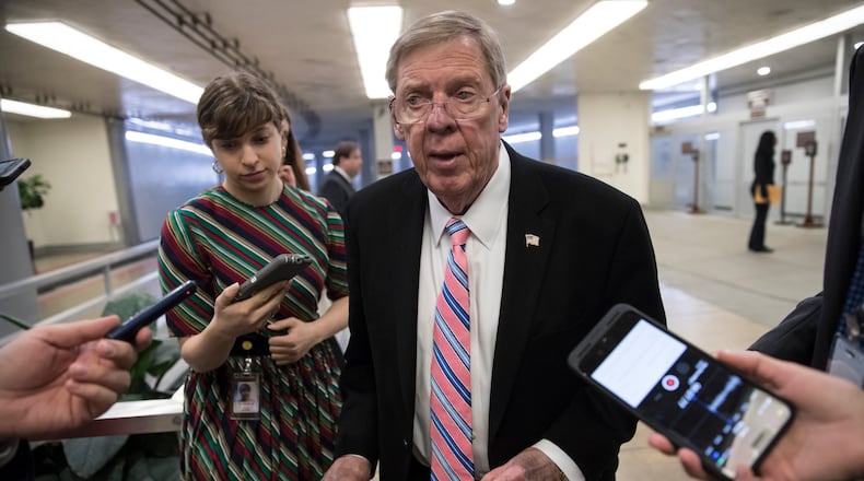 U.S. Sen. Johnny Isakson, R-Ga., speaks to reporters on his way to the floor for a procedural vote in the Senate earlier this month. AP/J. Scott Applewhite