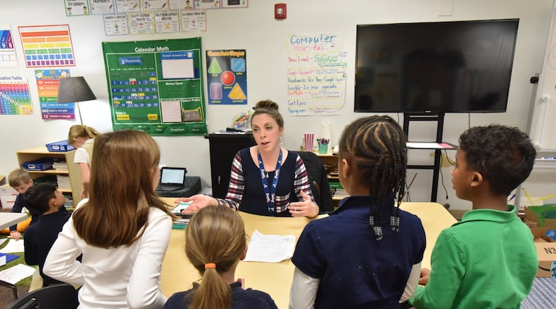 Second grade teacher Leah Owen teaches her class at Brookhaven Innovation Academy in Norcross on Thursday. The state charter school opened in 2016 and has been in a temporary facility in Norcross. But it now plans to build a permanent school building in Chamblee after securing $12 million in tax-exempt municipal bond financing. HYOSUB SHIN / HSHIN@AJC.COM