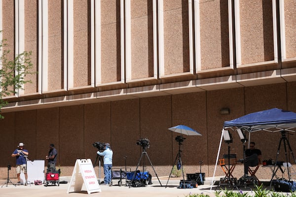 The assembled media are set up for live shots in front of Maricopa County Courthouse where the murder trial of Lori Vallow Daybell, who is charged with conspiring to murder her estranged husband, is being held Monday, April 21, 2025, in Phoenix. (AP Photo/Ross D. Franklin)