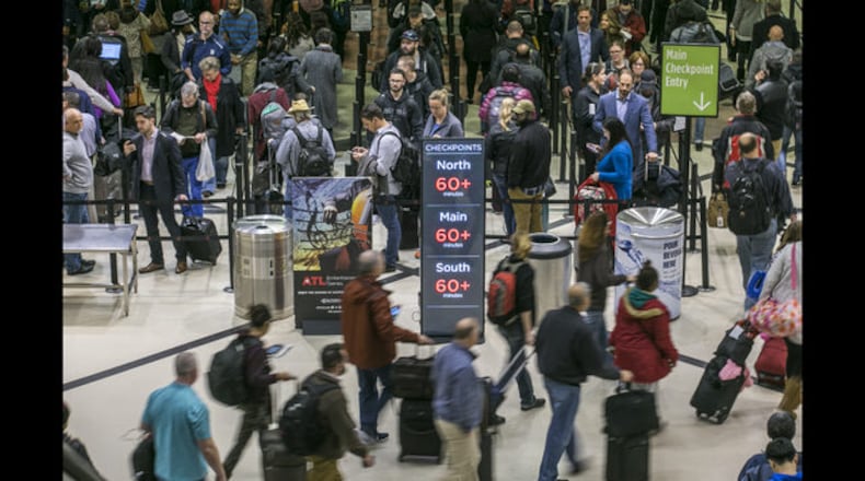 Security lines at Hartsfield-Jackson International Airport in Atlanta stretch more than an hour long amid the partial federal shutdown, causing some travelers to miss flights on Monday morning, Jan. 14, 2019. The long lines signaled staffing shortages at security checkpoints, as TSA officers have been working without pay since the federal shutdown began Dec. 22. (John Spink/Atlanta Journal-Constitution via AP)